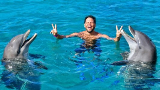 Dolphin Swim zwemmen dolfijnen Curacao lachen zingen