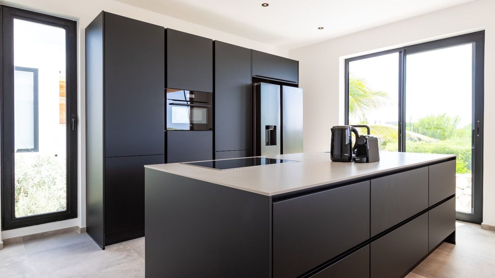 LXRY Villas Curaçao 7 Open kitchen with a cooking island in a luxury villa on Curaçao